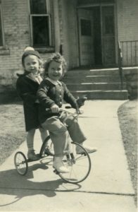 Kids on Tricycles having fun.